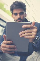 Businessman holding digital tablet.