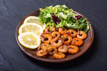 Salad with lattuce , lemon and shrimps