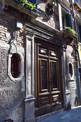 Monumental Wooden Doorway in a Venetian Side Street. 