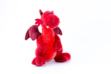 Red dragon push stuffed toy isolated in white background
