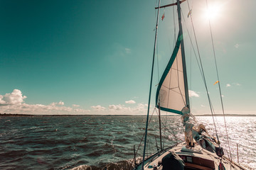 Yachting on sail boat during sunny weather