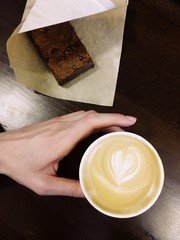 Having cup of coffee with heart sign on top with chocolat sweet coockie