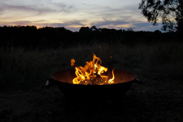 Warming beside the fire pit on an Easter weekend camping trip