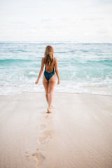 Young beautiful girl enjoying her day at the beach. 