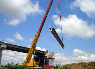 Crane fixed the concrete beam