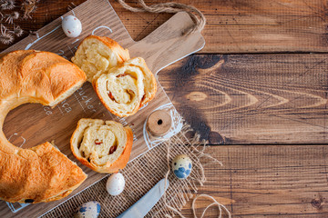 Rajndling - Traditional Austrian Easter roll on a wooden table, top view, copy space