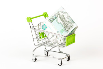 Food trolley, full of Russian 1000 banknotes. On a white background.