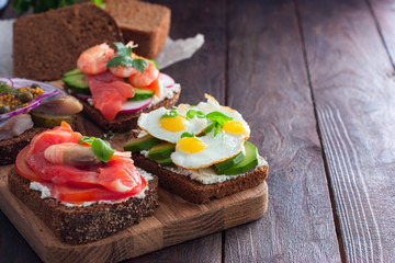 Danish open sandwich Smorrebrod on rye bread, copying space