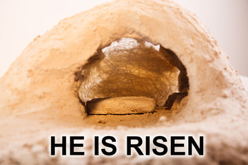 The stone is rolled away from the grave