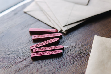 Man makes the stamp using sealing wax on the envelope