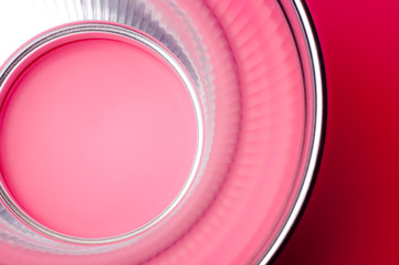 Reflection of pink light in the reflector.