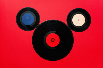 Top view of old vinyl records as Mickey Mouse theme.