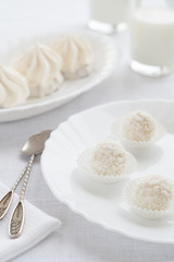 White candy and cake on a light background