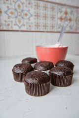 Tasty cupcakes on background table. Homemade chocolate muffin cupcake with cream buttercream icing. Birthday cupcake. Valentine cupcake sweets. Close up view delicious sweet dessert
