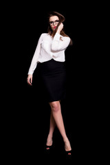 Fototapeta premium portrait of a sexy business woman in the studio on a black background