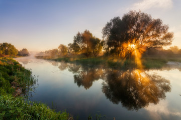 Reflection of a beautiful dawn sky in a river