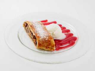 Restaurant dish. Apple strudel on the glass plate.