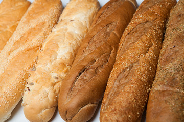 fresh baguettes on the wooden background