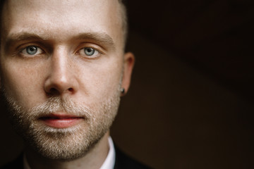 Sexy man in tuxedo and bow tie posing