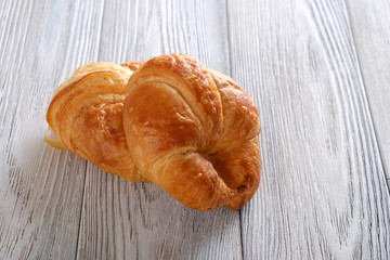 Croissants on a wooden table.