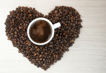 Coffee beans heart. Cup of coffee.