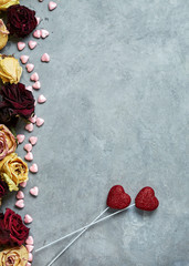 bright red hearts on the gray concrete background