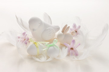 Fototapeta na wymiar Easter card with bird, eggs, rabbit, hyacinth flowers in pastel colors