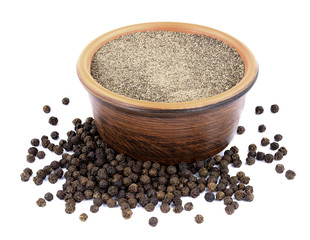 Black pepper in bowl isolated on white background