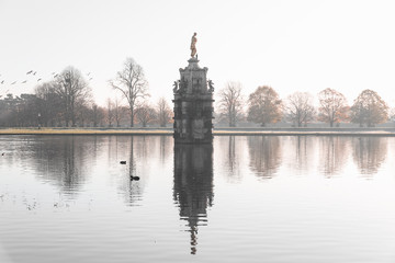 Diana fountain, early morning misty scene at Bushy Park in London