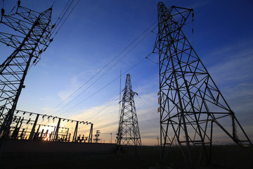 A high voltage substation in the sky at sunrise