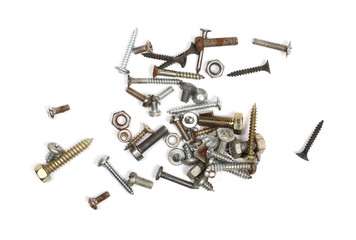 Pile of old rusty screw heads, bolts, metal nuts, isolated on white background, top view