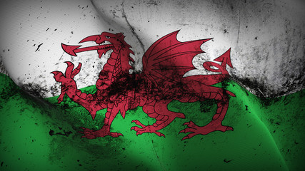 Wales grunge flag waving loop. Welsh dirty flag blowing on wind.