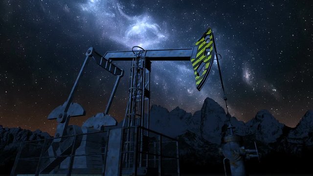 Oil pump jack under night starry sky