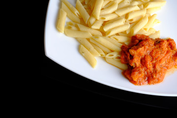 Pasta with meat on plate.