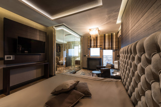 Interior of a master bedroom with luxury bathroom
