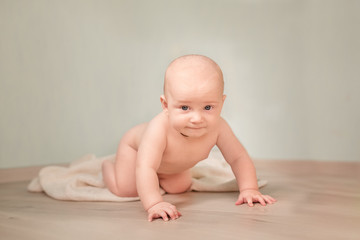 Cute happy baby boy crawling