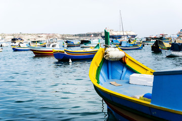 Naklejka na ściany i meble Mediterranean traditional colorful boats in Malta