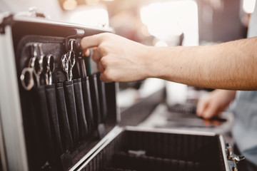 barber hand hairdresser's tools: combs, razors, scissors, clip-on hair clipper
