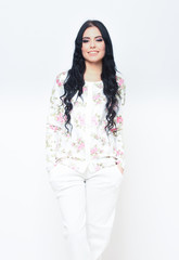 Lady in pajamas with happy face holds hands in pockets