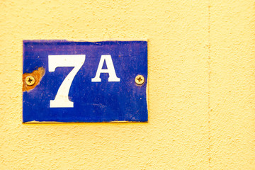 numerical tile on a stone wall background