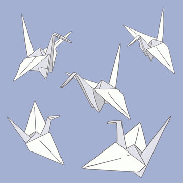Set of hand drawn paper origami birds on the blue