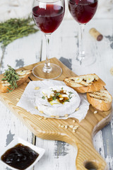 Baked camembert with toasts and thyme