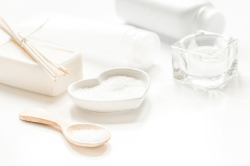 Fototapeta na wymiar white set of cosmetics for spa on table background