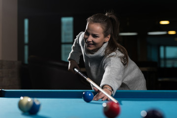 Young Woman Concentration On Ball