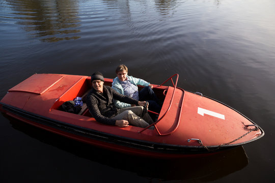 Senior couple in boat on the water