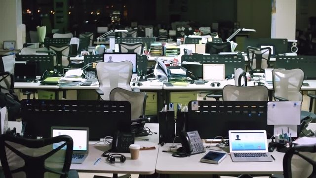 PAN of empty helpline office at night