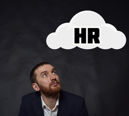 Above the businessman hangs a cloud with the inscription:HR