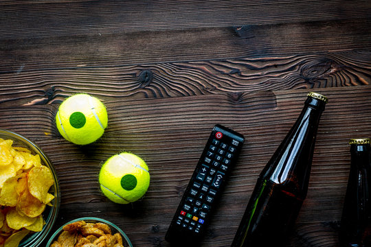 snacks for watching sport match on wooden background top view mo