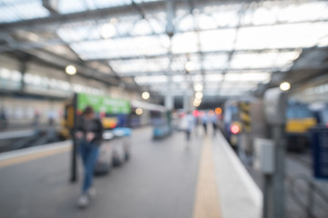 Blurred image bokeh of People walking around Edinburgh Waverley, the main Train Station in Edinburgh, United Kingdom