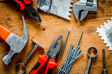 building implements set for repair on wooden background top view